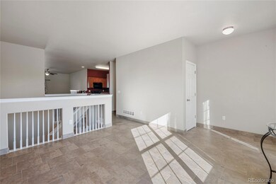 Front family room with tile floors and accent wall