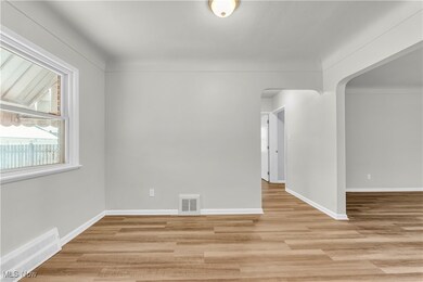 Spare room with light hardwood / wood-style flooring