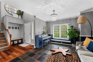 Dining room or office has crown/chair molding & tile flooring.