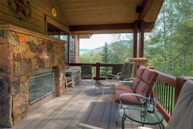 Covered Deck with Fireplace,, stream behind