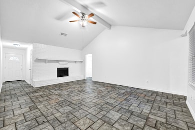 Spacious living room with soaring vaulted ceilings