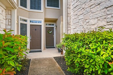 View of exterior entry with stucco siding