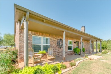Beautiful Front Porch View w/ Rustic Log Columns