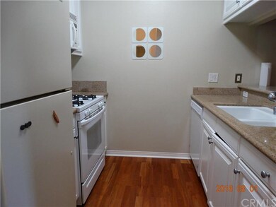 Modern kitchen with granite counters.