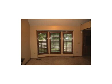 Bay window with faux wood blinds