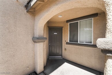 View of exterior entry with stucco siding