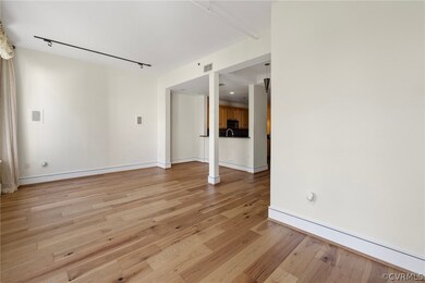 Empty room featuring hardwood / wood-style floorin