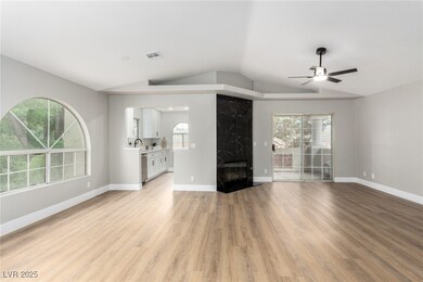 Unfurnished living room featuring lofted ceiling,