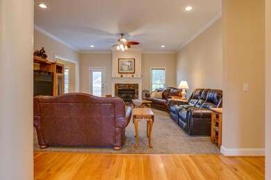 Foyer, with hardwood floor, opens to the great room.