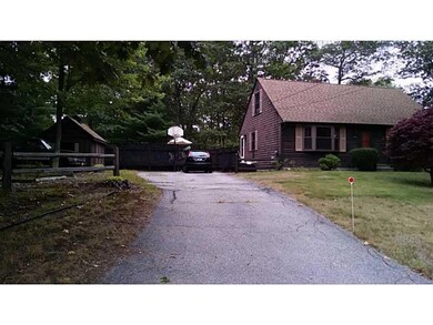 Exterior Front. Side yard and driveway