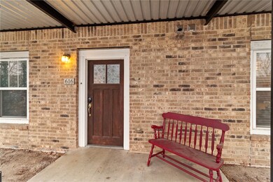 Property entrance with brick siding