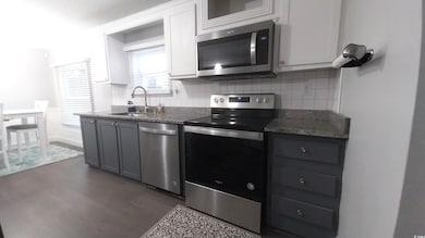 Kitchen with appliances with stainless steel finis
