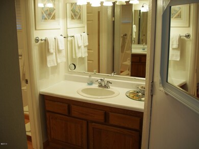 ONE OF TWO BATHROOM AREAS