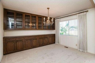 Formal Dining Room With Built In Cabinets and Glas