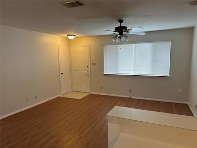 Foyer entrance featuring wood finished floors and