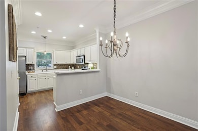 Kitchen has a breakfast bar and separate dining area.