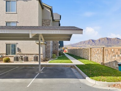 Covered parking lot featuring a mountain view