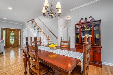 The dining area connects the living room & kitchen then opens to a great sunroom overlooking the peaceful back yard.