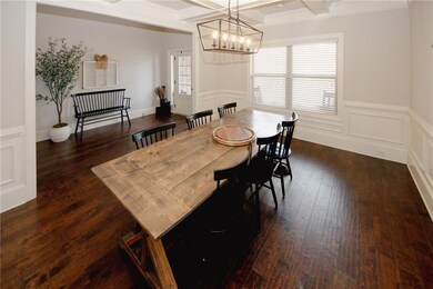 Dining area with a decorative wall, dark wood-styl