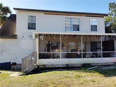 Back of home - screened lanai - patio doors from d
