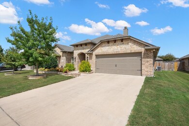View of front of property featuring a garage, a fr
