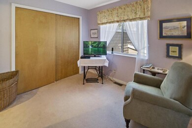 Large closet and sitting area near primary suite bath