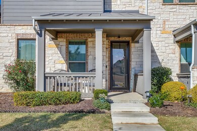 Doorway to property with stone siding and fornt porch