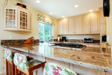 Bar seating at oversized granite counter