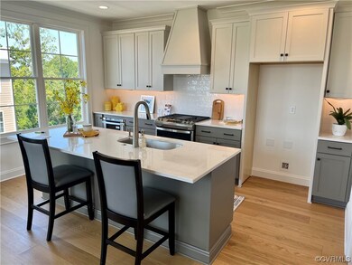 Photo of taken actual home. Kitchen features warm