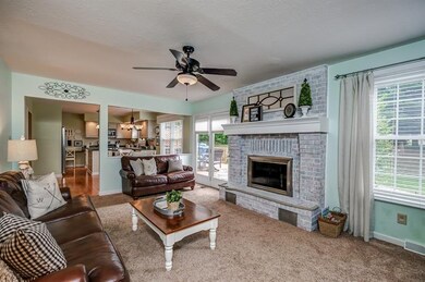 Kitchen opens to the family room with a brick log burning fireplace with gas starter.