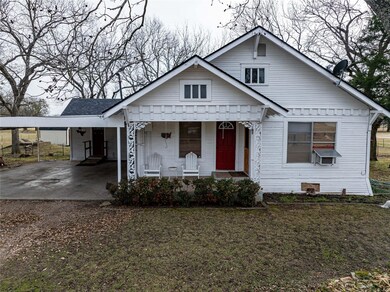 Bungalow-style house featuring a carport, cooling 