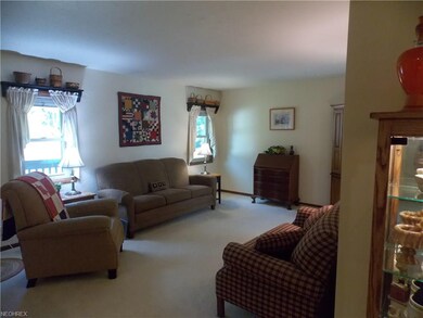 Comfortable living room with a balcony off this room to enjoy your backyard.