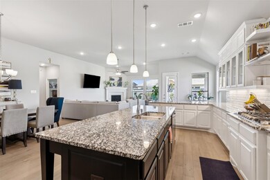 Kitchen with light hardwood / wood-style floors, w