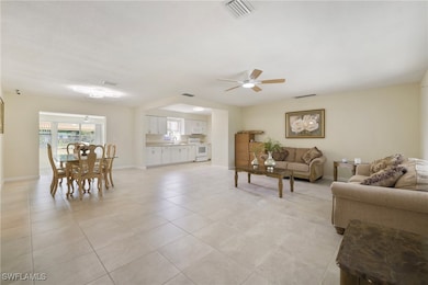 Living area with light tile patterned flooring, ce
