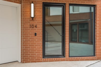 Property entrance with brick siding