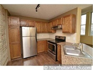 Beautiful Kitchen with Raised Oak Cabinets and Sta