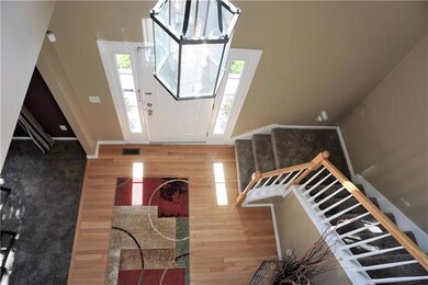 Two Story Entry with wood floor and curved stair c