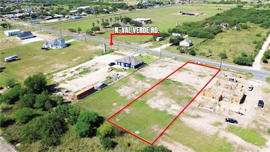 Aerial view of sparsely populated area featuring property boundaries highlighted