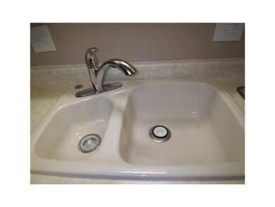 Kitchen. Cast iron sink with updated faucet.