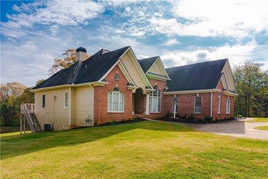 View of front of property with a front yard and ce