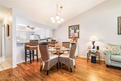 Dining area with light wood finished floors, baseb