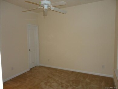 downstairs master bedroom with ceiling fan