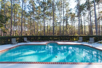 Private pool backs up to woods