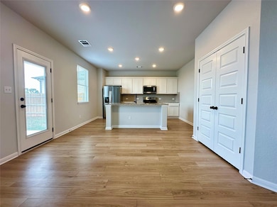 Kitchen featuring stainless steel appliances, whi