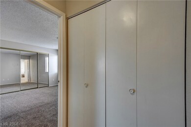 Washer & dryer located next to master bedroom in c