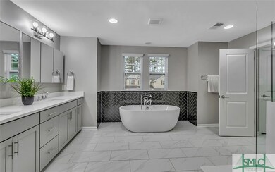 Ensuite with ample cabinetry, tiled walk in shower