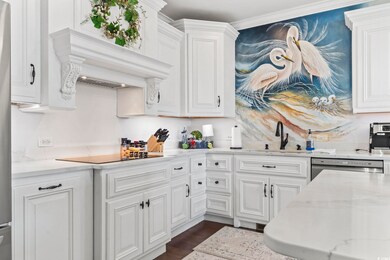 Kitchen featuring black electric cooktop, crown mo