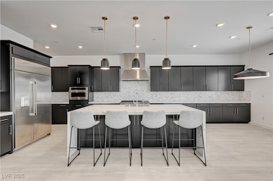 Kitchen featuring appliances with stainless steel