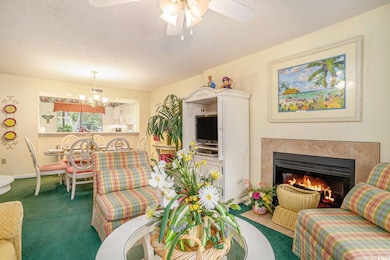 Living/Dining area open for shared fun and conversations. Features a wood burning fireplace.