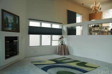 High ceiling living room with fire place and lots 